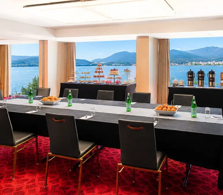 Boardroom-style meeting set-up with harbour and mountain views at Pinnacle Hotel Harbourfront